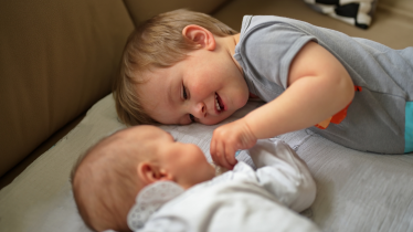 Helping Siblings Adjust to a New Baby - MHA Blog Featured IMG